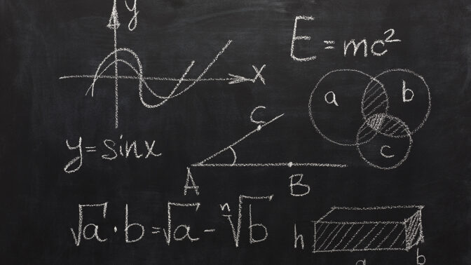 Physics formulas on a blackboard