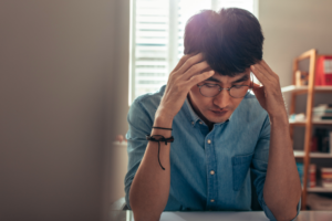 Stressed IB student at desk Stressed IB student at desk