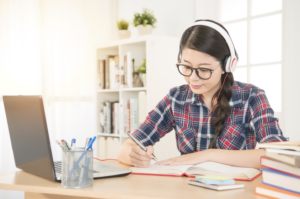 student listening through headphones