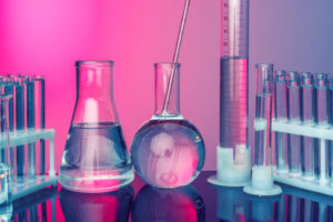 Science concept. Glass test tubes on red background
