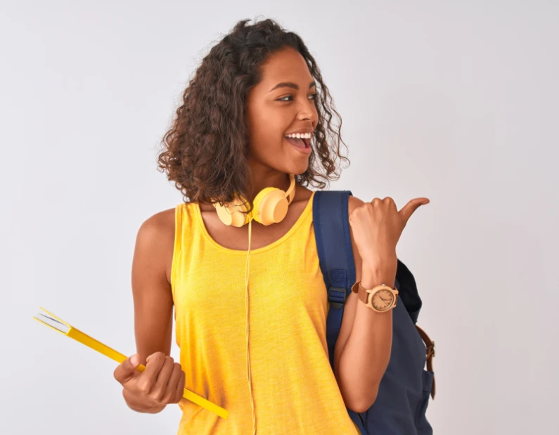 Woman in yellow with school book and bag